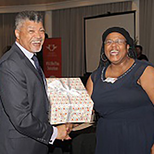 Prof Ihron Rensburg Presents A Gift To Ms Maphefo