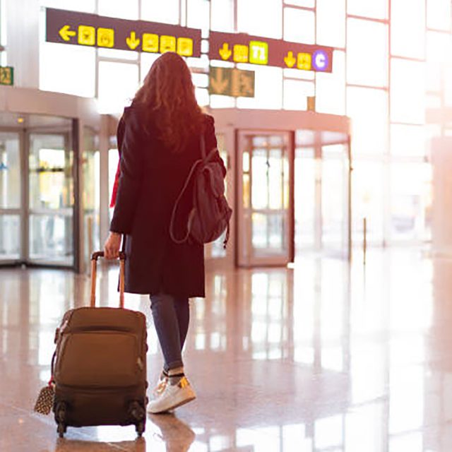 Picture Of Woman Walking In Airport