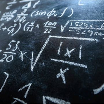 A Blackboard Filled With Formulas And Equations