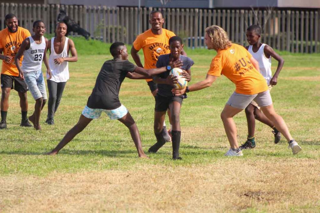 Uj Senior Men's Rugby Players Playing With Learners At Jabulani Technical School In Soweto